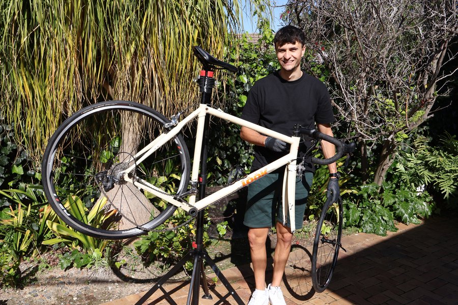 Franco McLeod, founder of The Goat Bike Shop, working on a bike